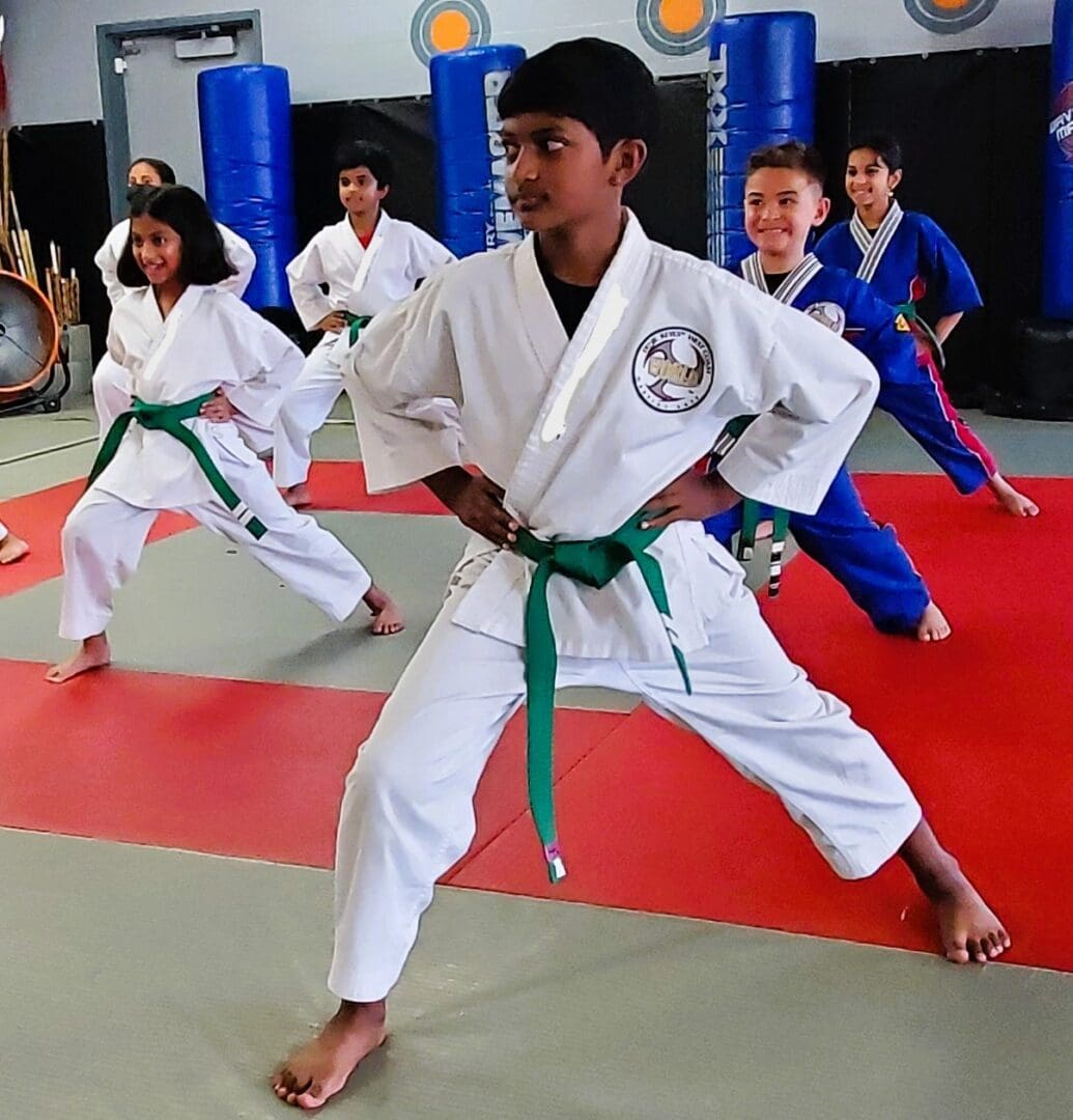 A group of young people practicing martial arts.