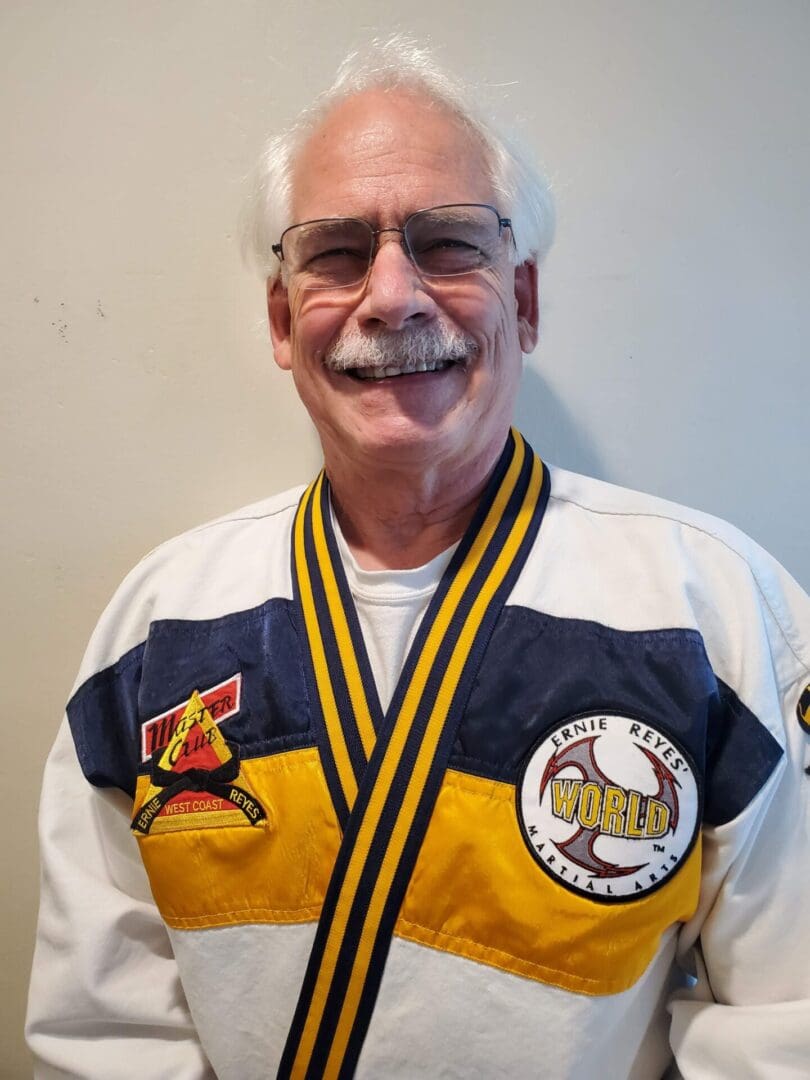 A man with a mustache wearing a baseball uniform.