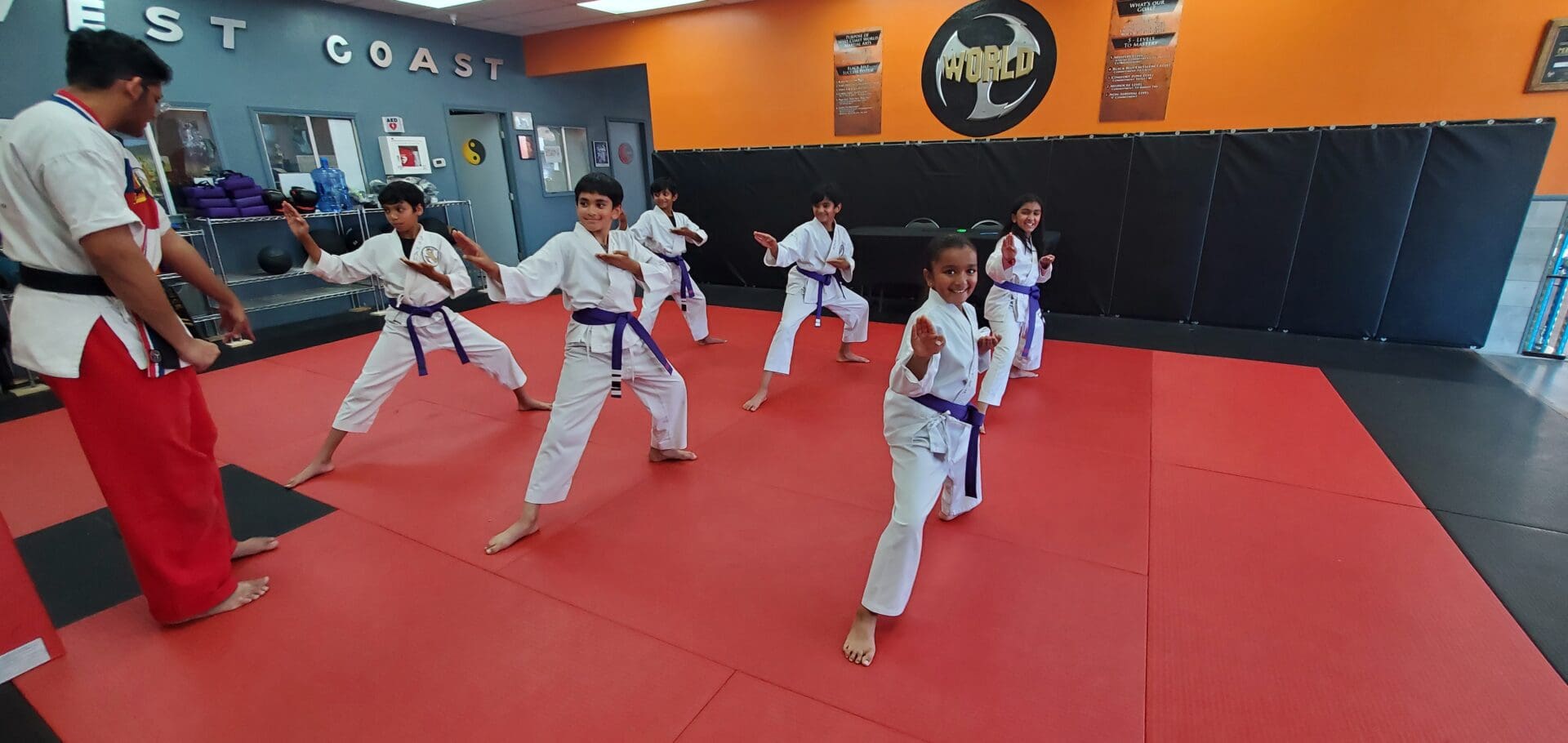 A group of young people practicing martial arts.